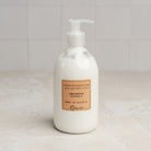 Lothantique Hand & Body Lotion - Verbena on a marble table at Addison West