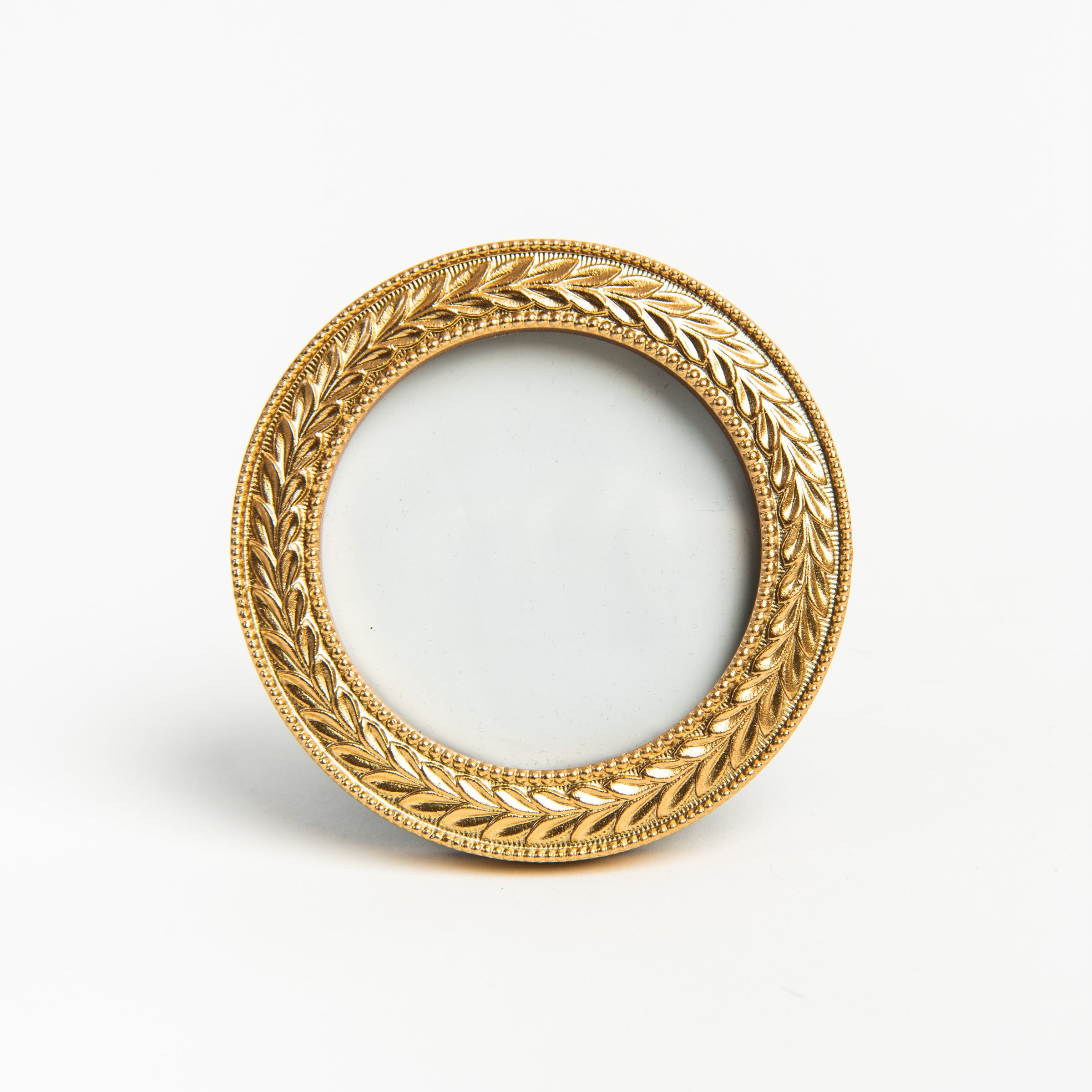 Mini Round Golden Laurel Wreath Picture Frame on a white background at Addison West