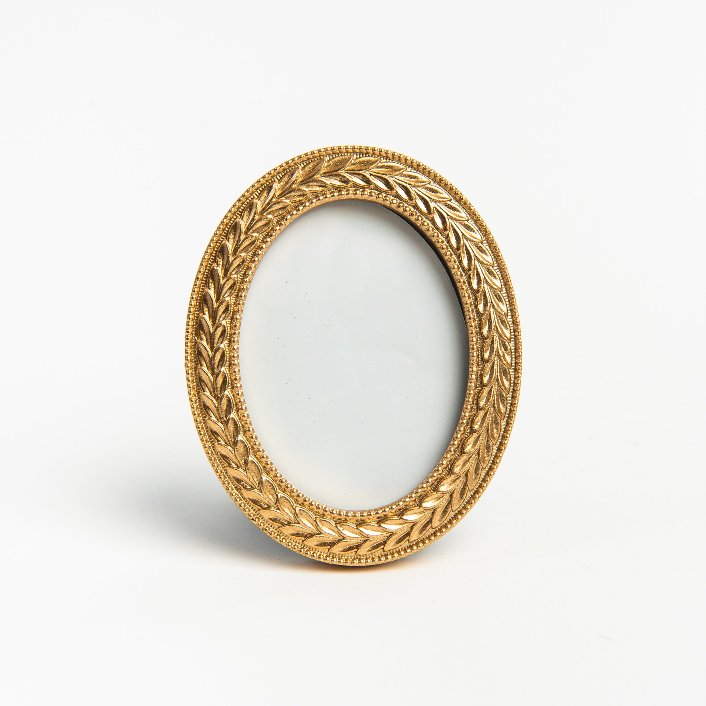 Mini Oval Golden Laurel Wreath Picture Frame on a white background at Addison West