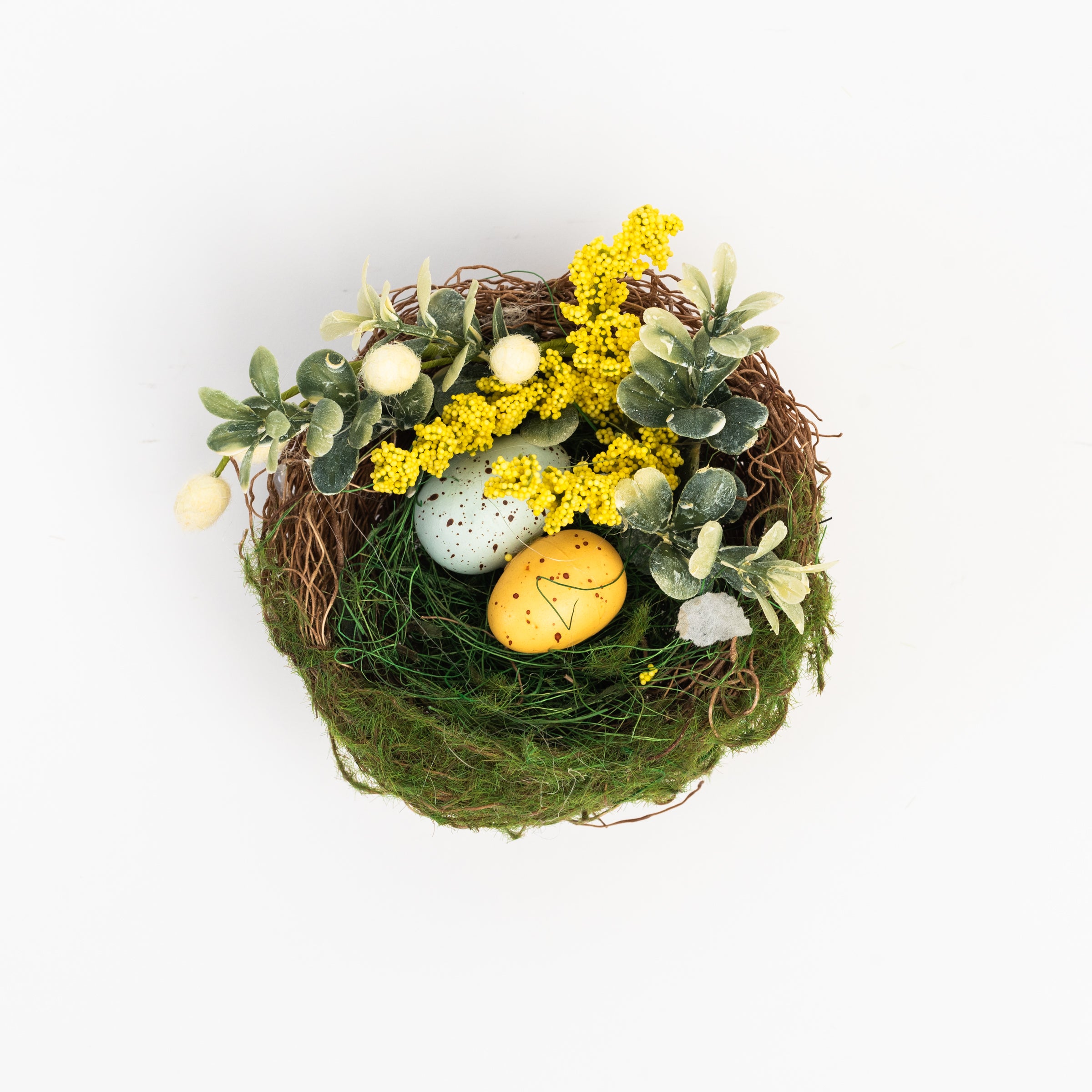 Easter Nest with Eggs and Faux Flowers on a white background at Addison West