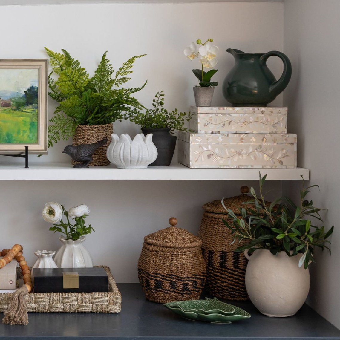 Indaba brand Milos Burnt Terracotta Mini Urn on a shelf with other decorative  objects - Addison West 