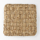 Adele 17.7L x 17.7W x 17.7H Medium Brown Seagrass Woven Square Pouf on a white background