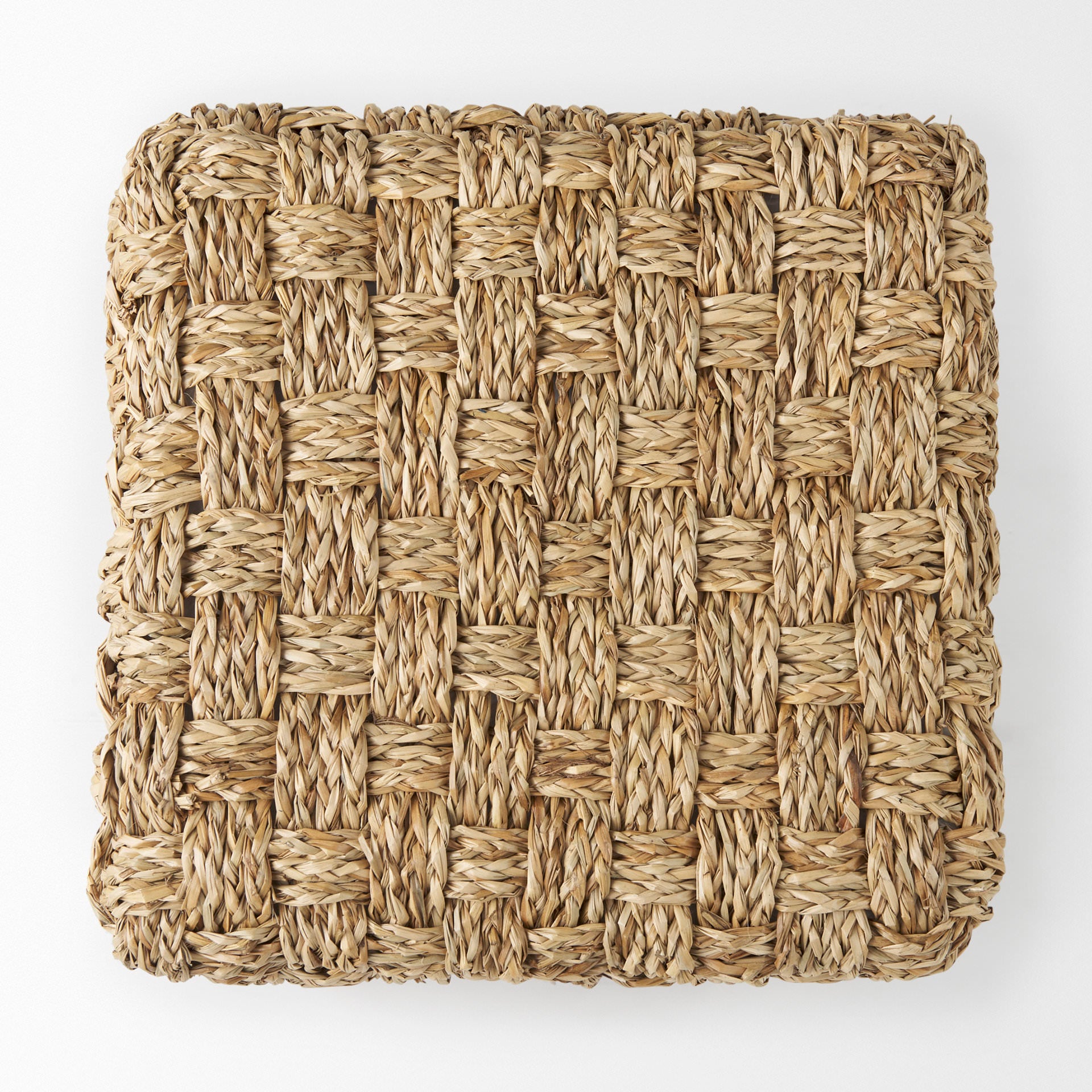 Adele 17.7L x 17.7W x 17.7H Medium Brown Seagrass Woven Square Pouf on a white background