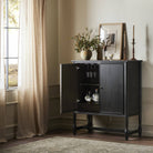 Amber Lewis x Four Hands Bari Bar Cabinet in Cracked Smoked Black Veneer in a neutral room at Addison West