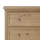 Close up of Amber Lewis x Four Hands Geoffrey Tall Dresser in Worn Oak Veneer on a white background at Addison West