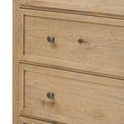 Close up of Amber Lewis x Four Hands Geoffrey Tall Dresser in Worn Oak Veneer on a white background at Addison West