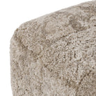 Close up of Amber Lewis x Four Hands Oslo Ottoman in Taupe Shearling on a white background at Addison West