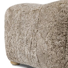 Close up of Amber Lewis x Four Hands Oslo Ottoman in Taupe Shearling on a white background at Addison West