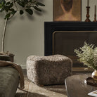 Amber Lewis x Four Hands Oslo Ottoman in Taupe Shearling in a modern living room at Addison West