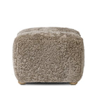 Amber Lewis x Four Hands Oslo Ottoman in Taupe Shearling on a white background at Addison West