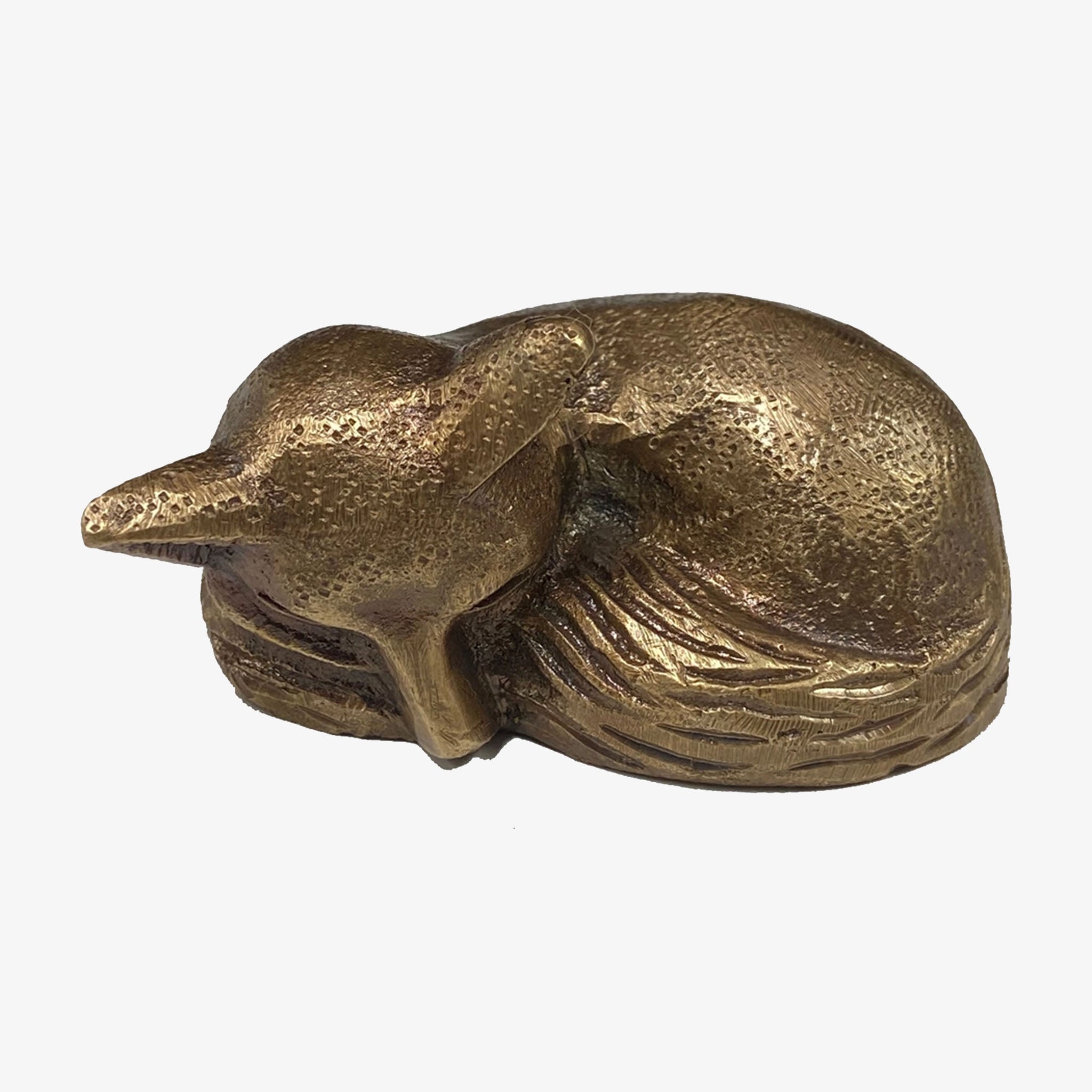 Antiqued Brass Sleeping Fox on a white background