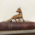 Antiqued Brass Fox figurine on a stack of brown antique books