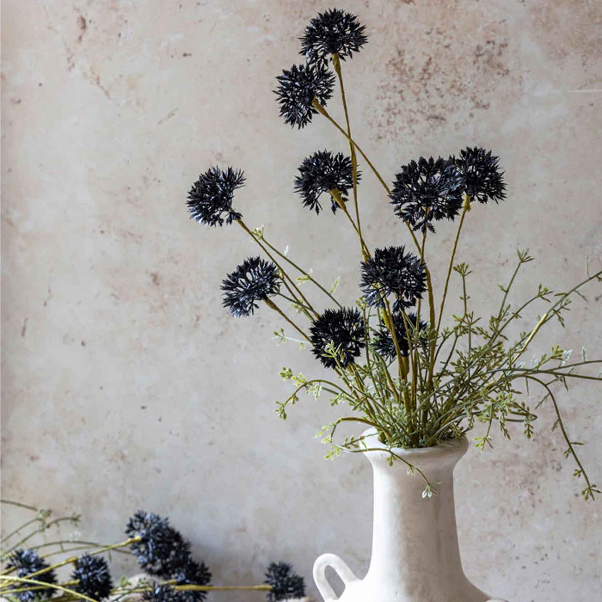 Abigail Ahern Faux Melaleuca Stem in Noir in a white vase on a beige background at Addison West