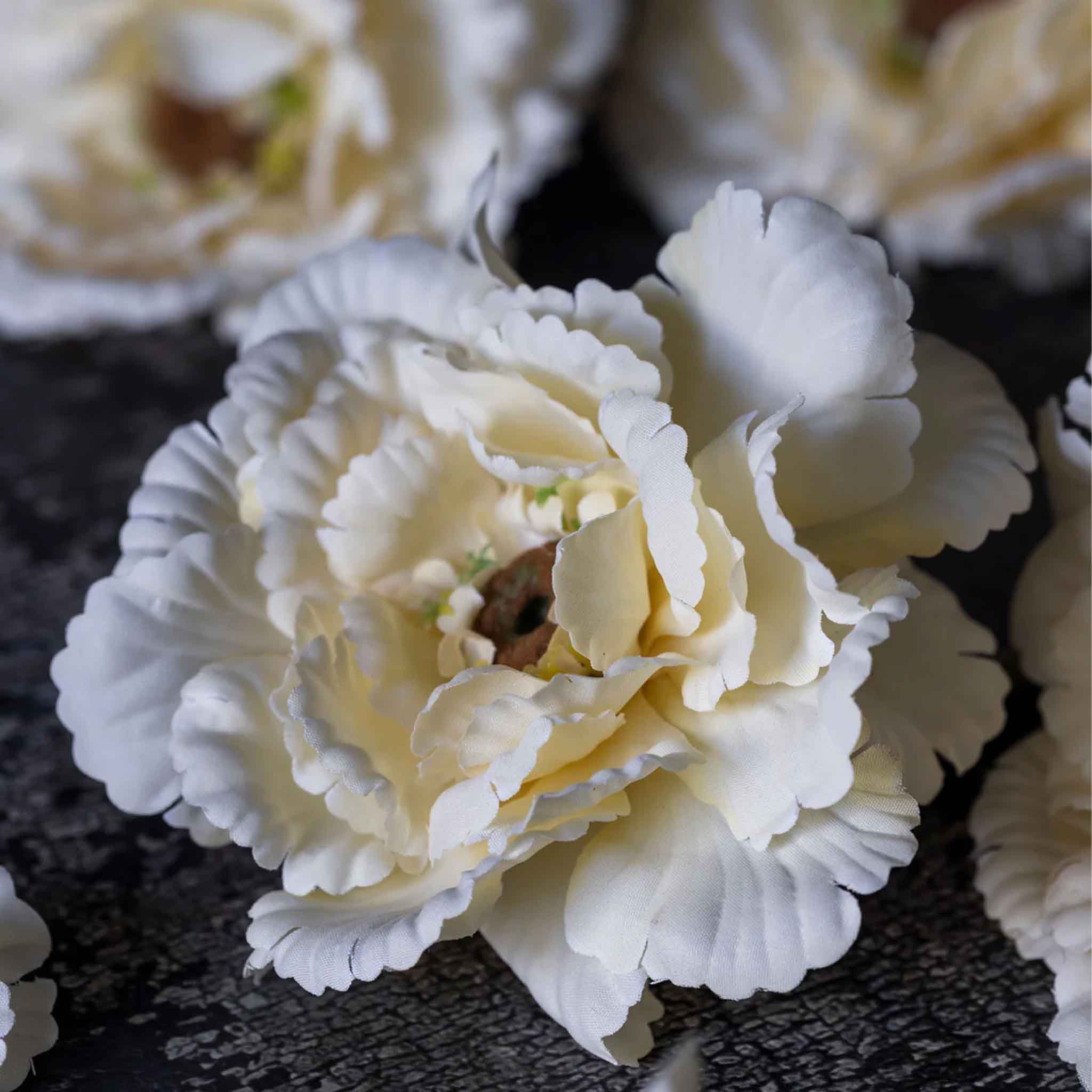 Close up of Abigail Ahern Faux Peony in Garden Lace on a dark grey background at Addison West