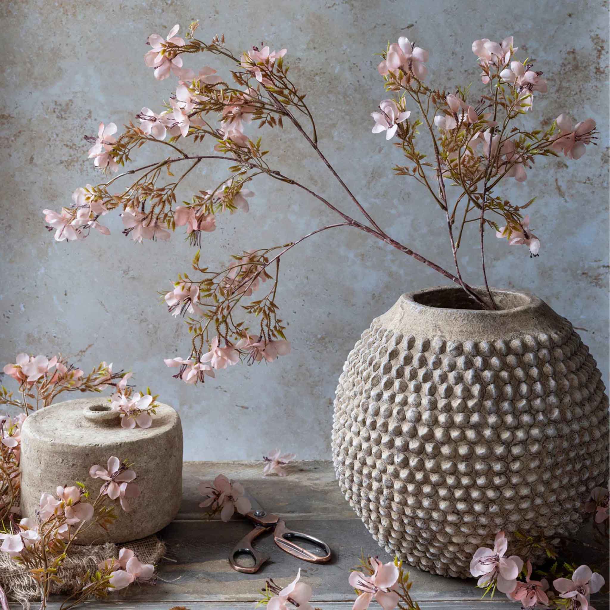 Abigail Ahern Faux Prunus in Blossom in a cream vase at Addison West