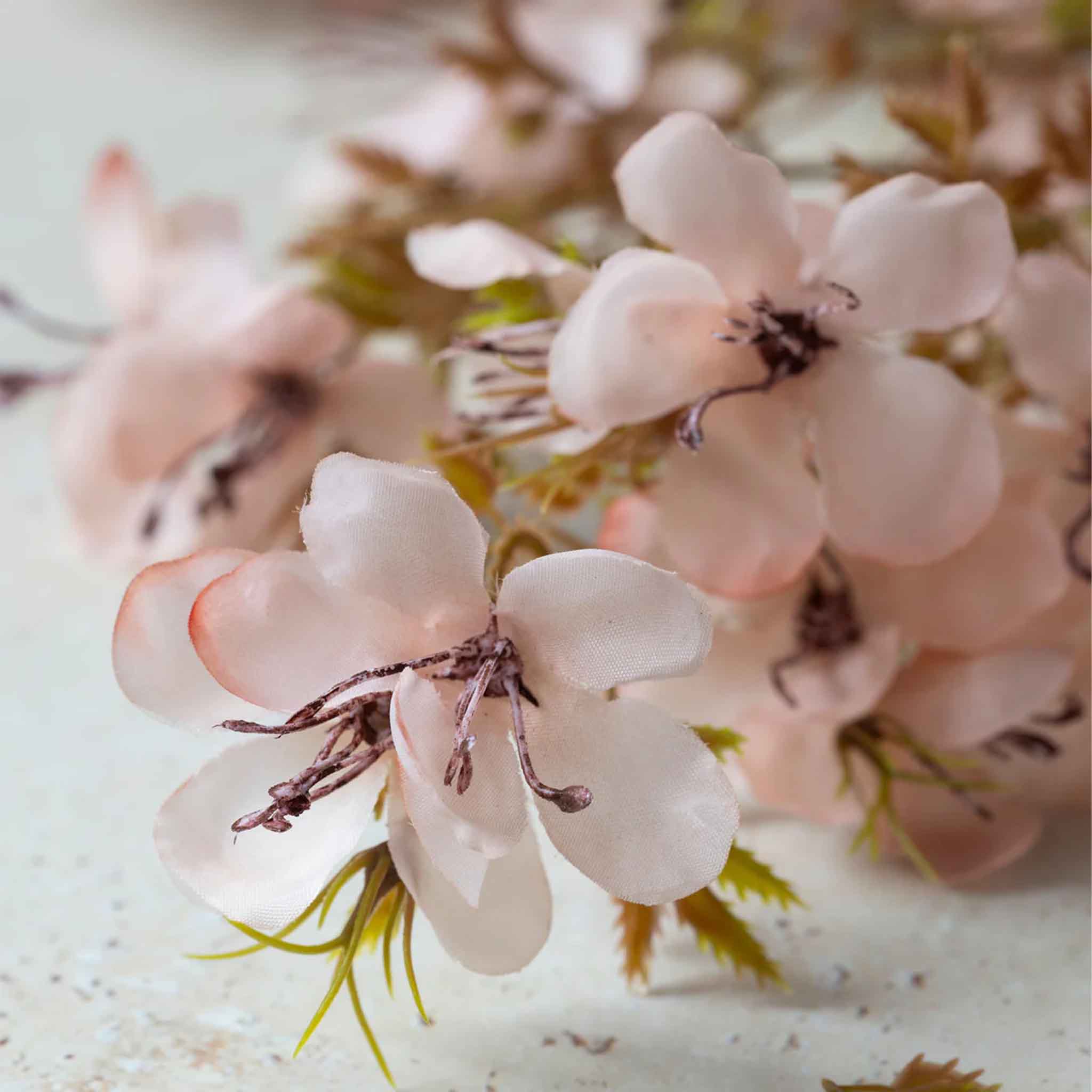 Close up of Abigail Ahern Faux Prunus in Blossom on a beige background at Addison West