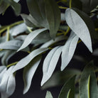 Close up of Abigail Ahern Faux Willow in Emerald on a grey background at Addison West