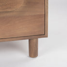 Close up of Astrid 36L x 17W x 30.3H Medium Brown Solid Wood 3 Drawer Cabinet on a white background