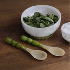 Beatriz Ball RESIN Rio Bubble Salad Servers in Green on a wood table at Addison West