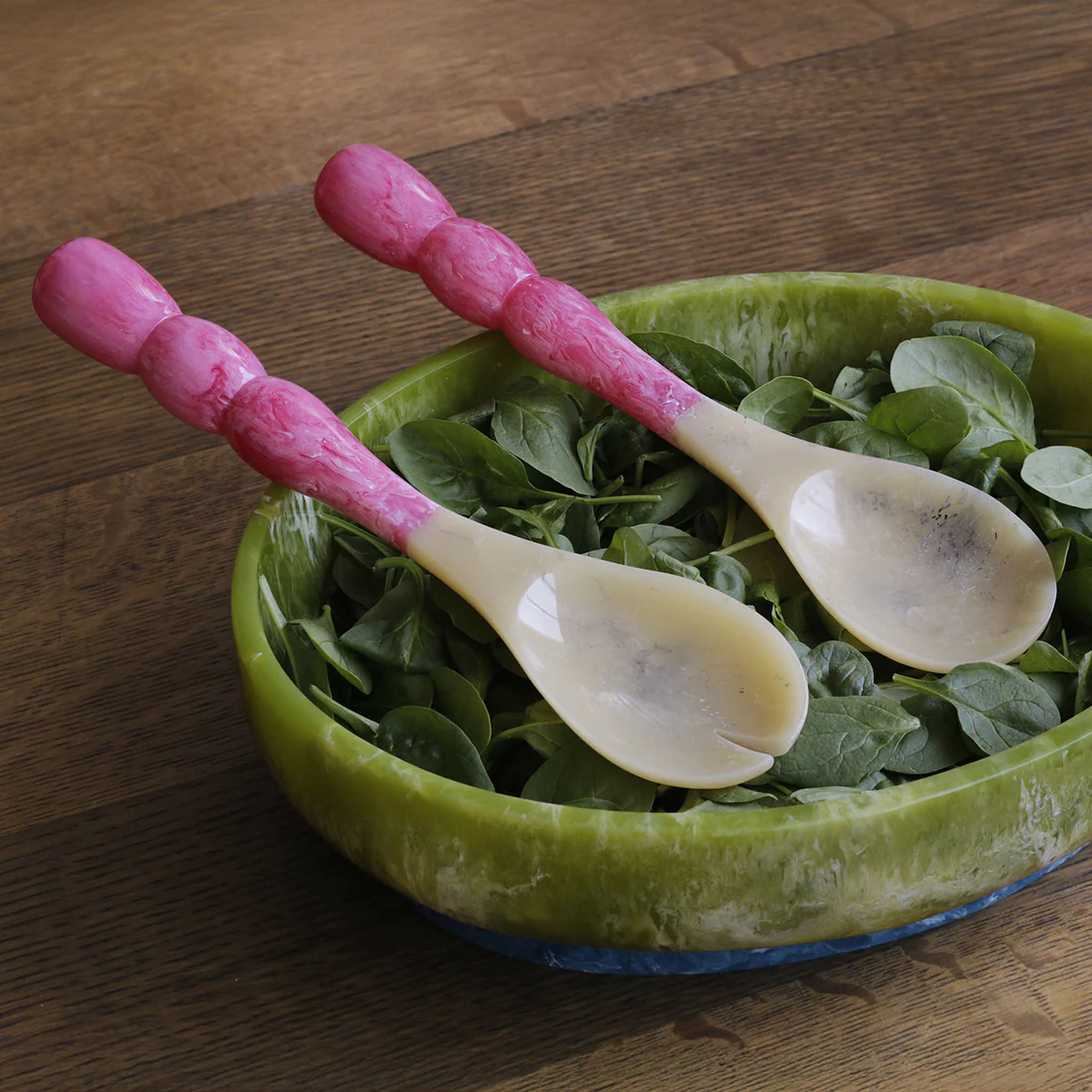 Beatriz Ball RESIN Rio Bubble Salad Servers in Pink in a bowl at Addison West