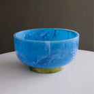 Beatriz Ball RESIN Rio Large Bowl with Base in Blue & Green on a white table at Addison West