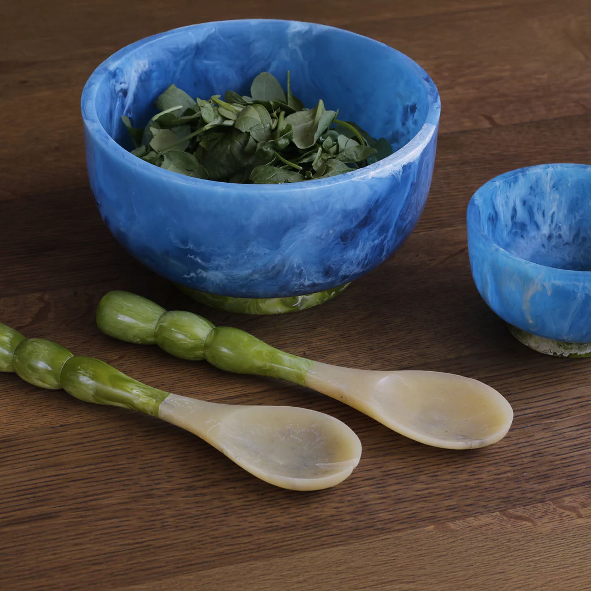 Beatriz Ball RESIN Rio Large Bowl with Base in Blue & Green on a wood table at Addison West