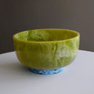 Beatriz Ball RESIN Rio Large Bowl with Base in Green & Blue on a white table at Addison West