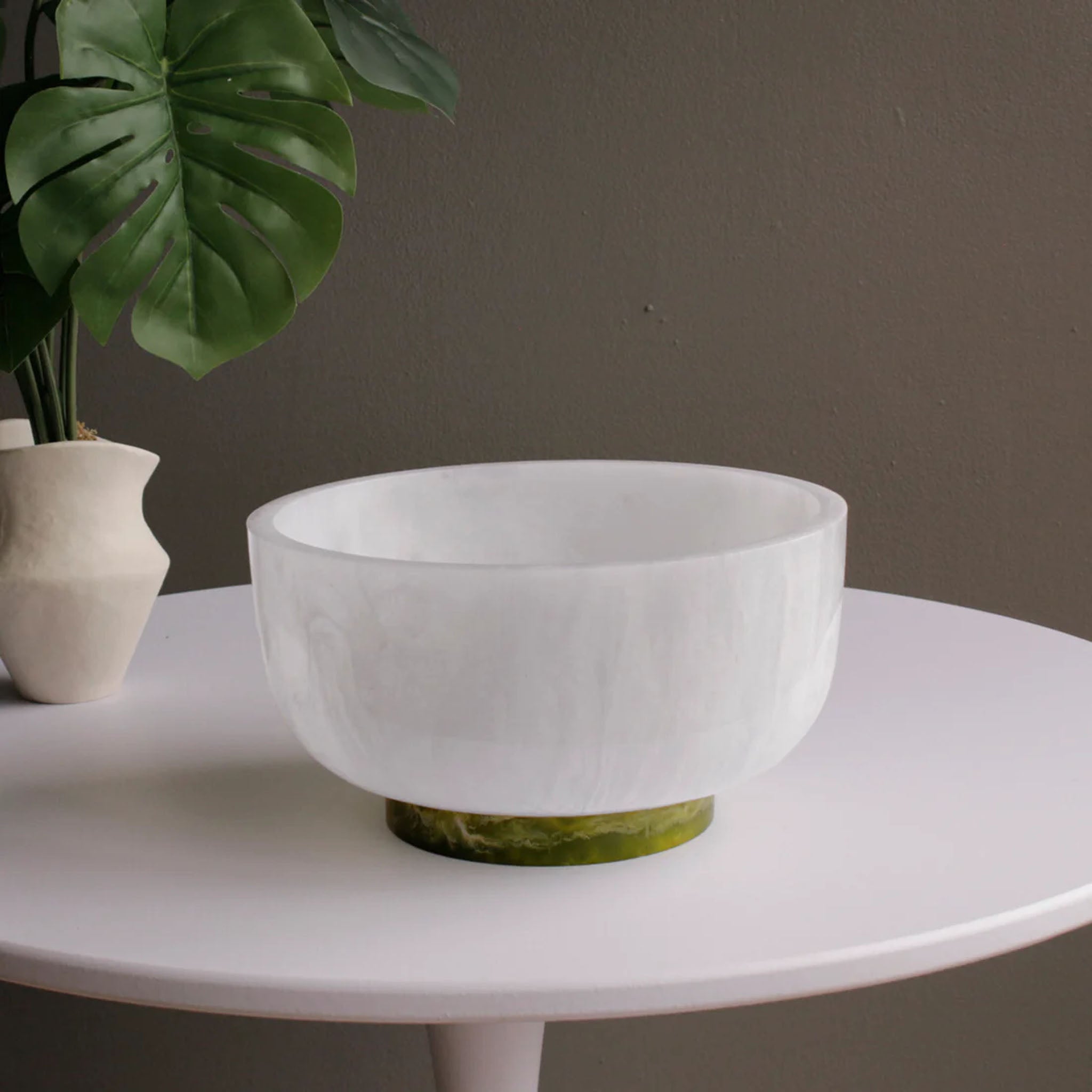 Beatriz Ball RESIN Rio Large Bowl with Base in White & Green on a white table at Addison West