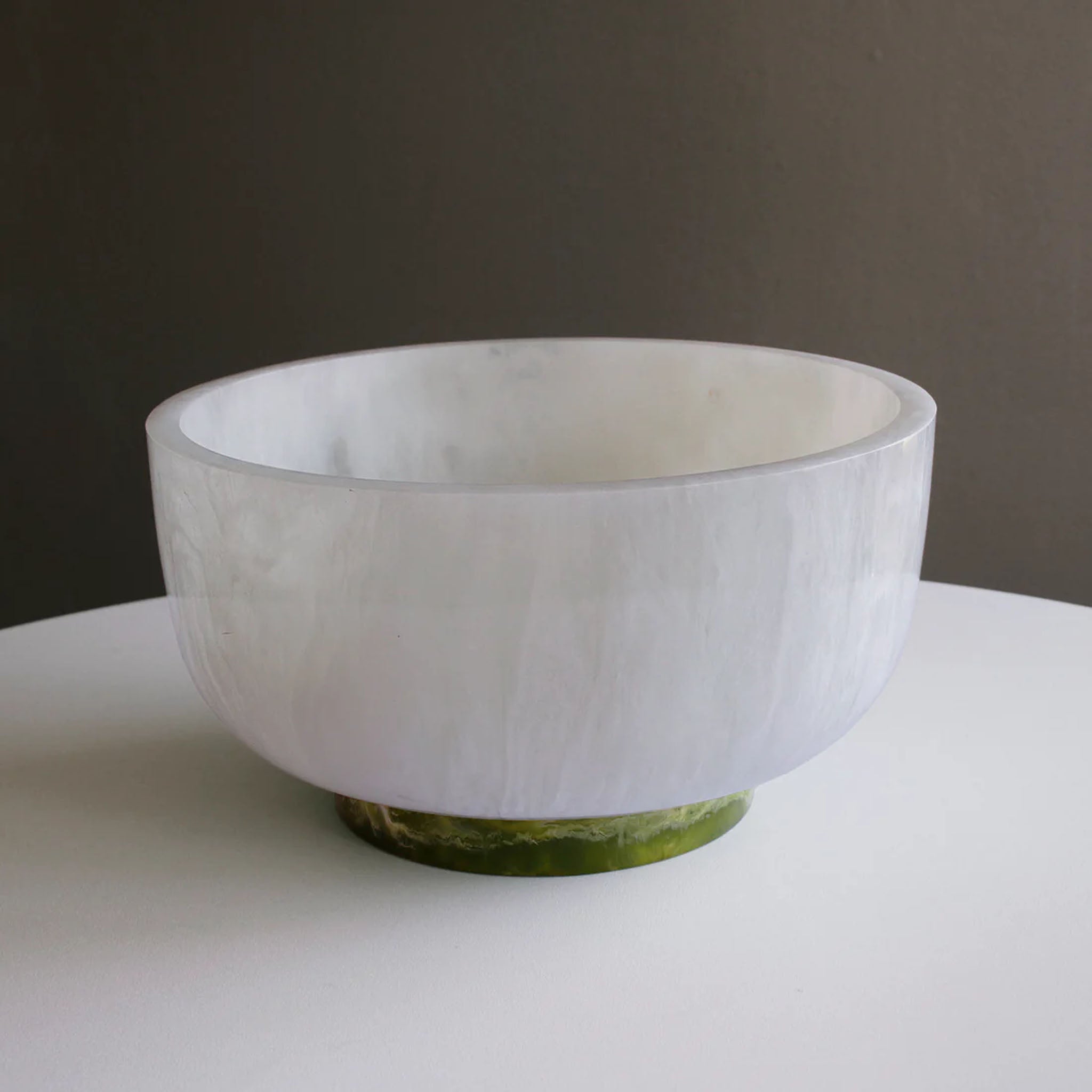 Beatriz Ball RESIN Rio Large Bowl with Base in White & Green on a white table at Addison West