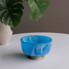 Beatriz Ball RESIN Rio Small Bowl with Base in Blue & Green on a white table at Addison West