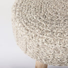 Close up of Bina Wool Stool on a white background