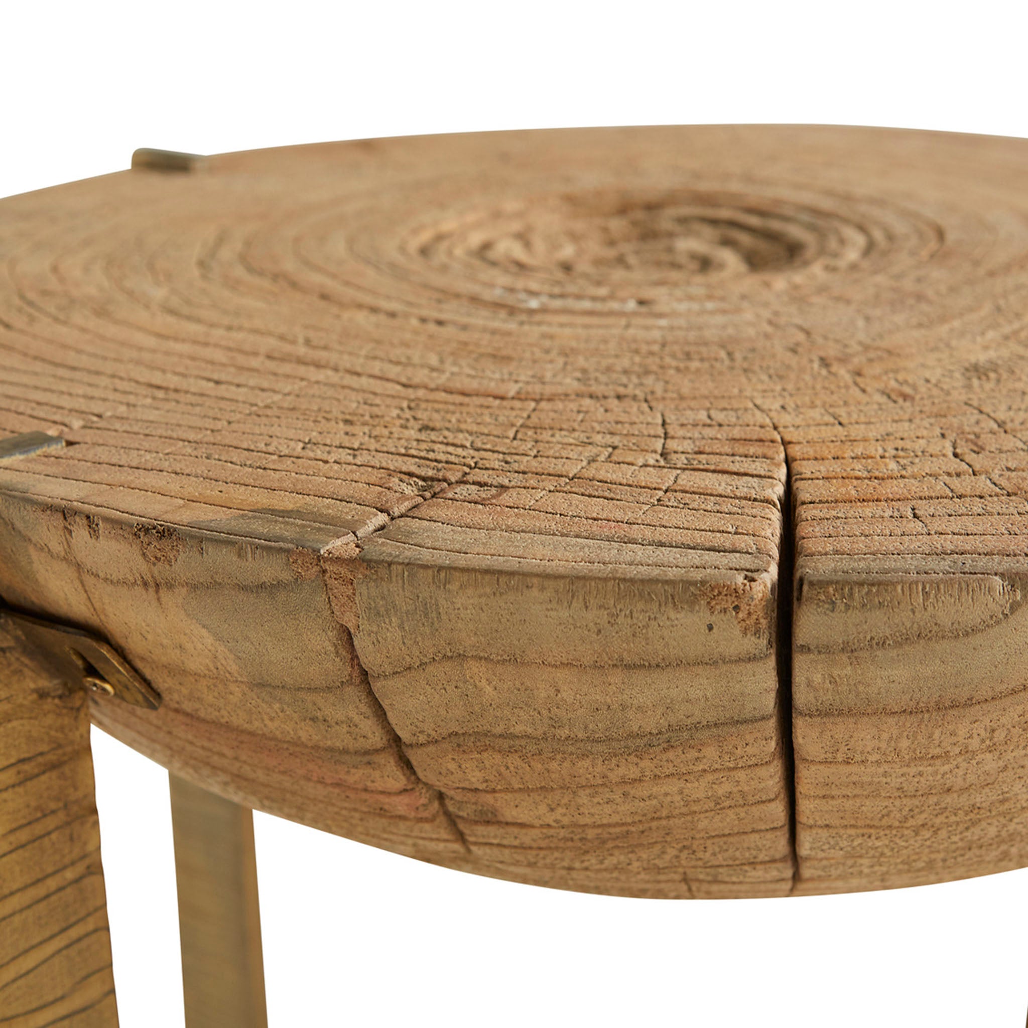 Round rustic wood end table with brass toned iron frame base on a white background