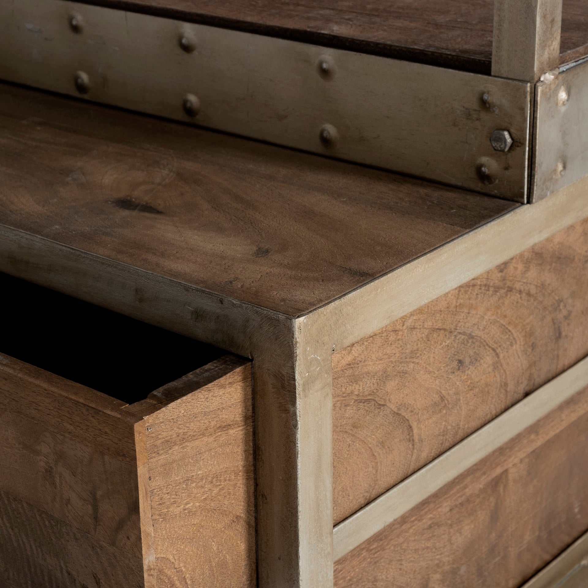 Close up of Brodie nickel metal light brown wood bookcase with drawers and a ladder