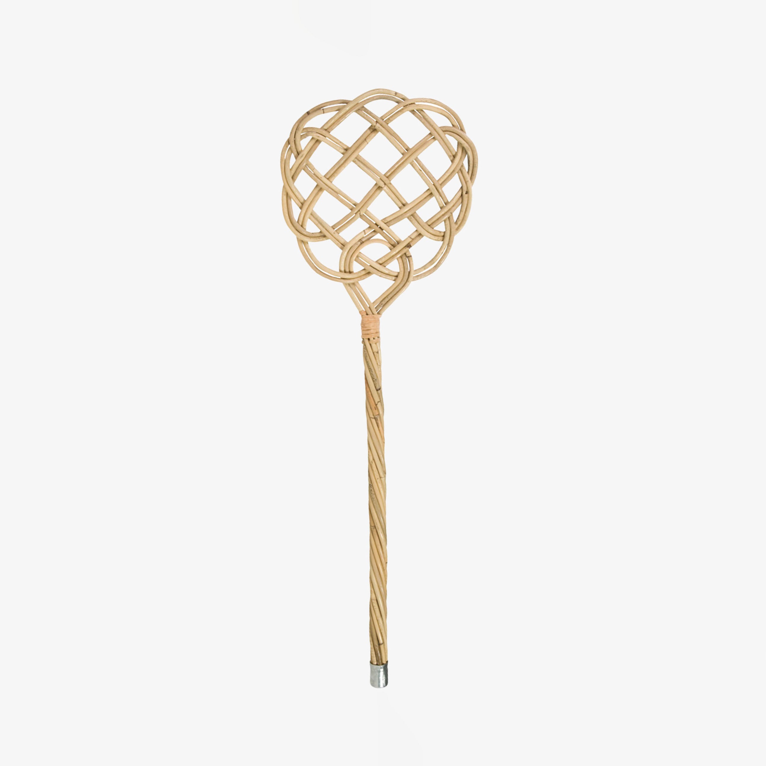 Rattan carpet beater with long handle and metal cap  on a white background