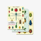 Set of three notebooks with bugs and insects on cover by Cavallini paper on a white background