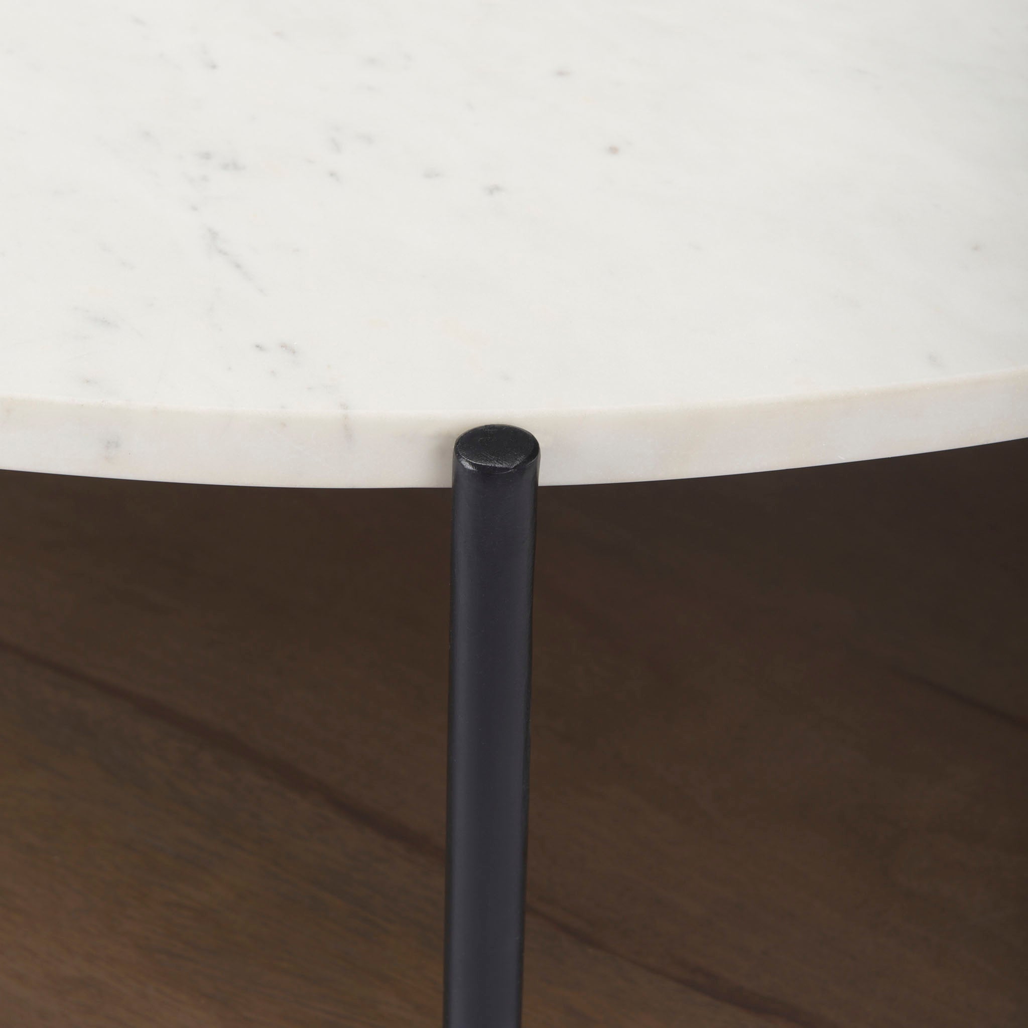 Round Marble Top Coffee Table with Dark Brown shelf and black iron frame on a white background