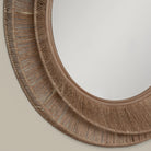 Close up of Collins Small Jute Mirror on a beige background