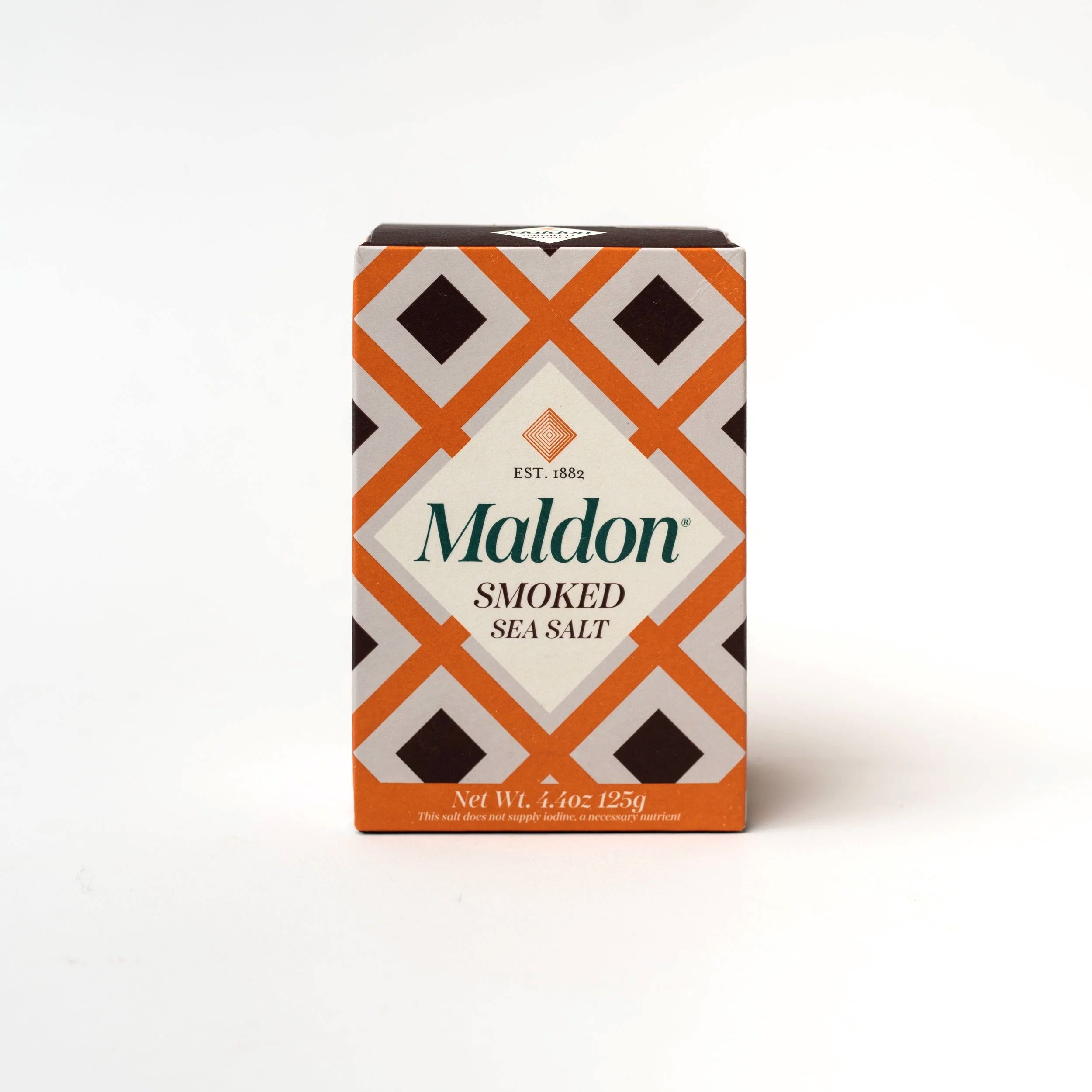 Orange and brown geometric patterned box of Maldon smoked sea salt on a white background