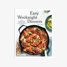 Front cover of cookbook Easy Weeknight Dinners Cookbook featuring chicken in a cast iron pan on a white background