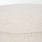 Close up of Elise Cream Boucle Upholstered Storage Ottoman on a white background