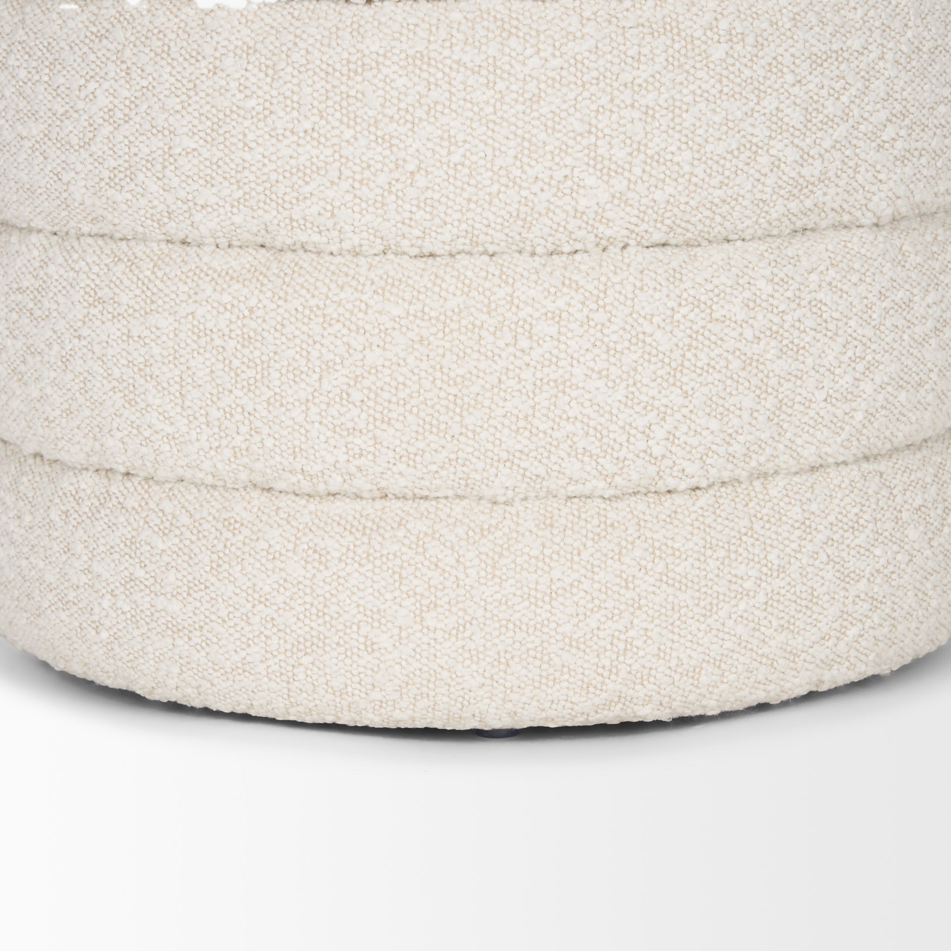 Close up of Elise Cream Boucle Upholstered Storage Ottoman on a white background