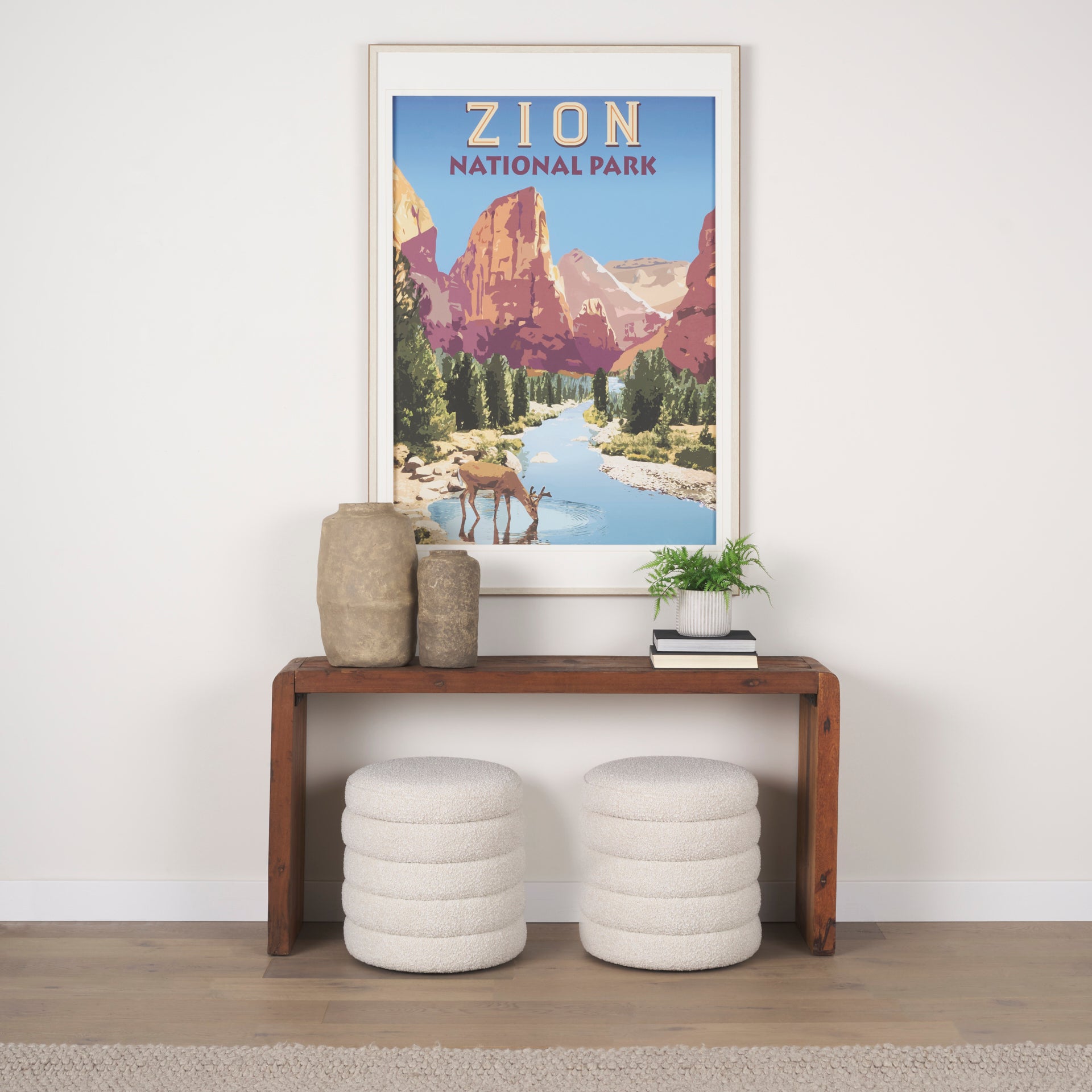 Elise Cream Boucle Upholstered Storage Ottoman in a hallway below a table