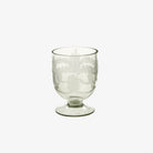 Etched glass footed candle holder on a white background