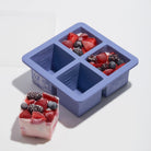 W & P brand Silicon 4 Cube Food Freezer Storage Tray in Blue on a white counter surface