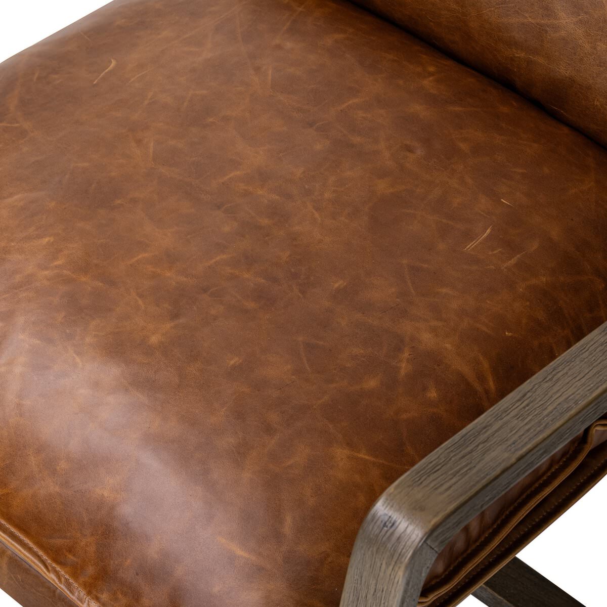 Close up of Four Hands Ace Chair in Raleigh Chestnut on a white background