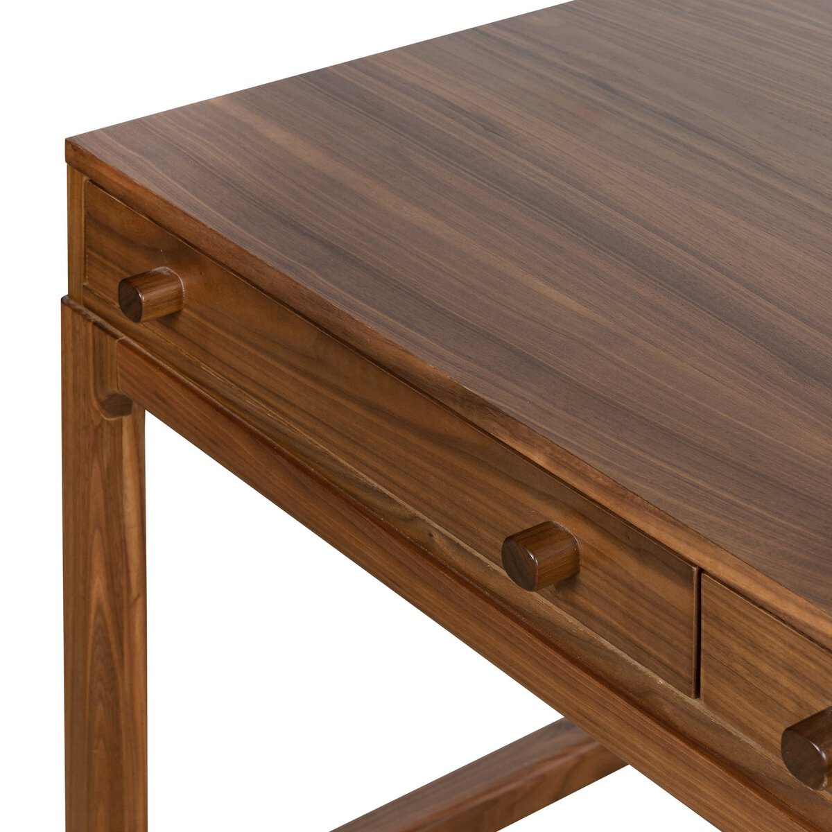 Close up of Four Hands Arturo Desk in Natural Walnut Veneer on a white background