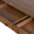 Close up of drawers of Four Hands Arturo Desk in Natural Walnut Veneer on a white background