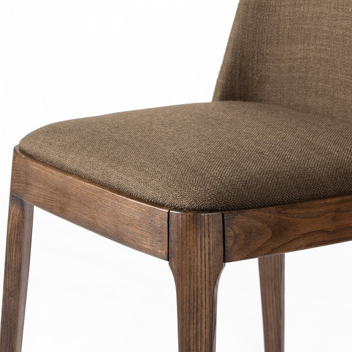 Close up of Four Hands Bryce Armless Dining Chair in Bilton Olive on a white background