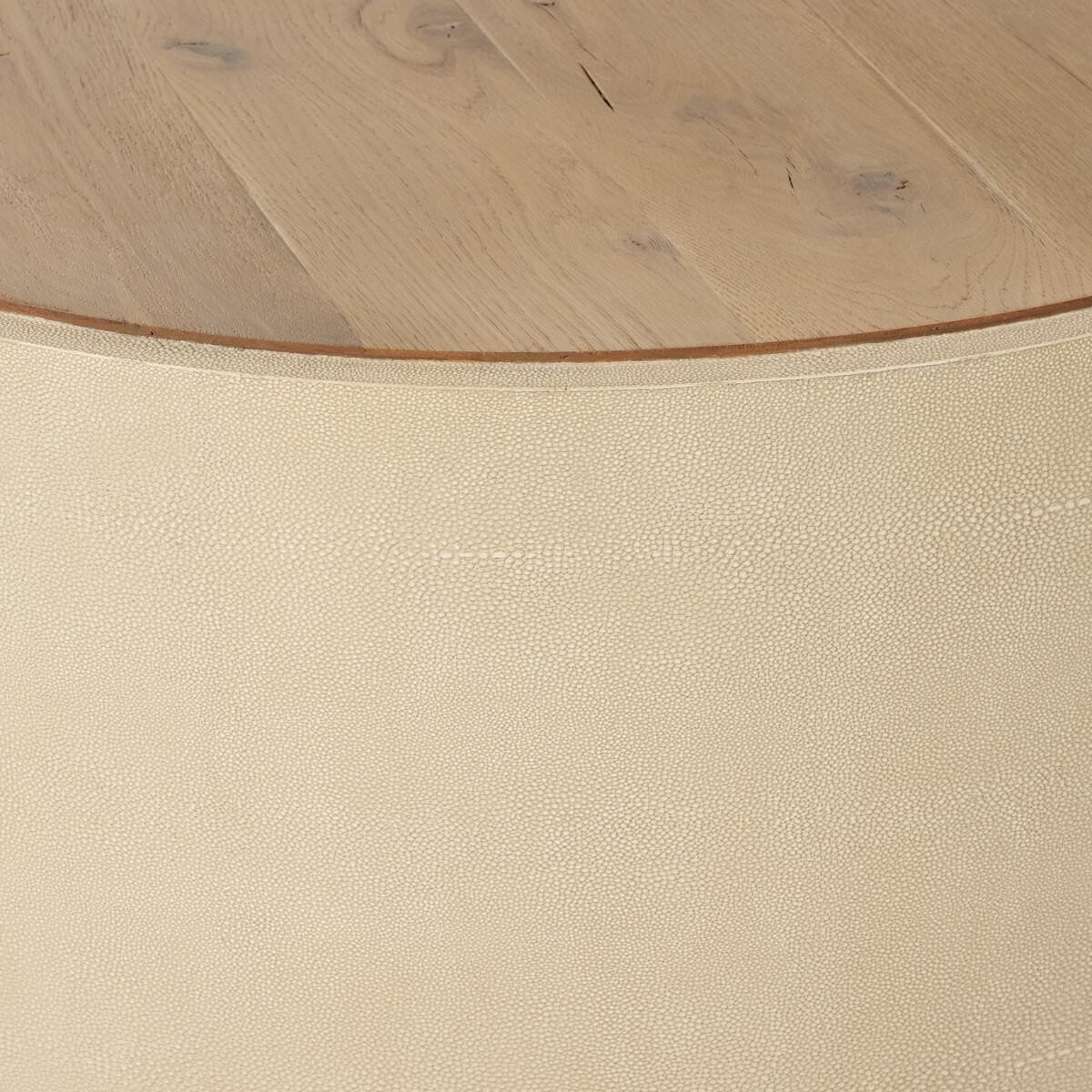 Close up of Four Hands Crosby Round Coffee Table in Light Cream on a white background