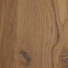 Close up of Four Hands Crosby Round Coffee Table in Light Cream on a white background